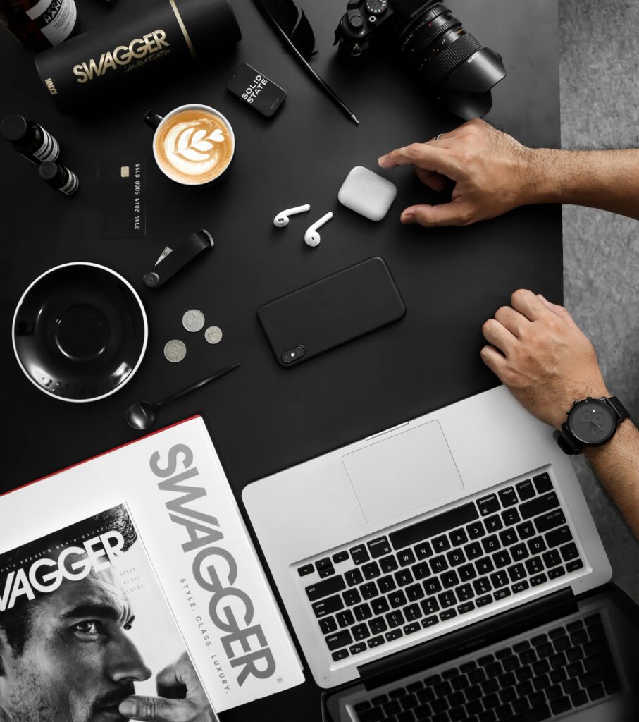 pexels-photo-3568520-3568520 A contemporary workspace featuring tech devices, coffee, and a stylish magazine.